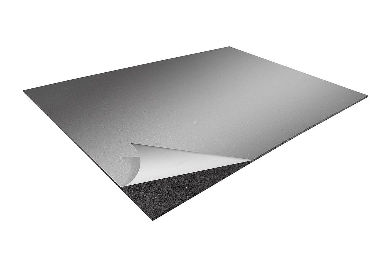 Self-adhesive fire-resistant protection mat “REGUPOL solar fire glue” with peel-off backing, corner lifted.